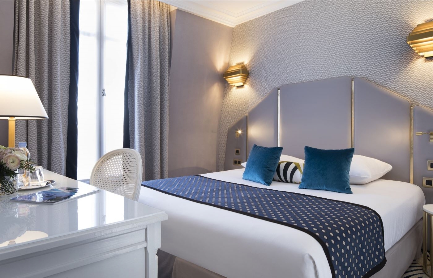 Classic Room at the Hôtel Victor Hugo with desk space, high-speed fiber Wi-Fi and Art-Deco decor for business & leisure travelers.