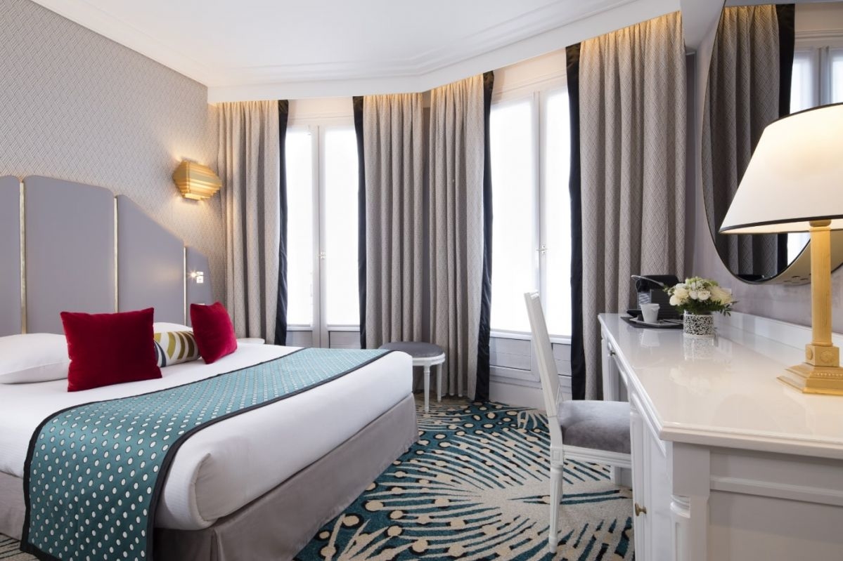 Superior Room at the Hôtel Victor Hugo with desk space, high-speed fiber Wi-Fi, and Art-Deco decor for business & leisure travelers.
